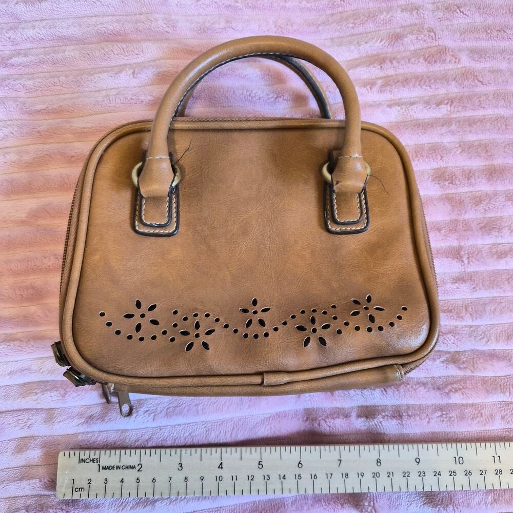 Brown floral cutout small hand bag purse.